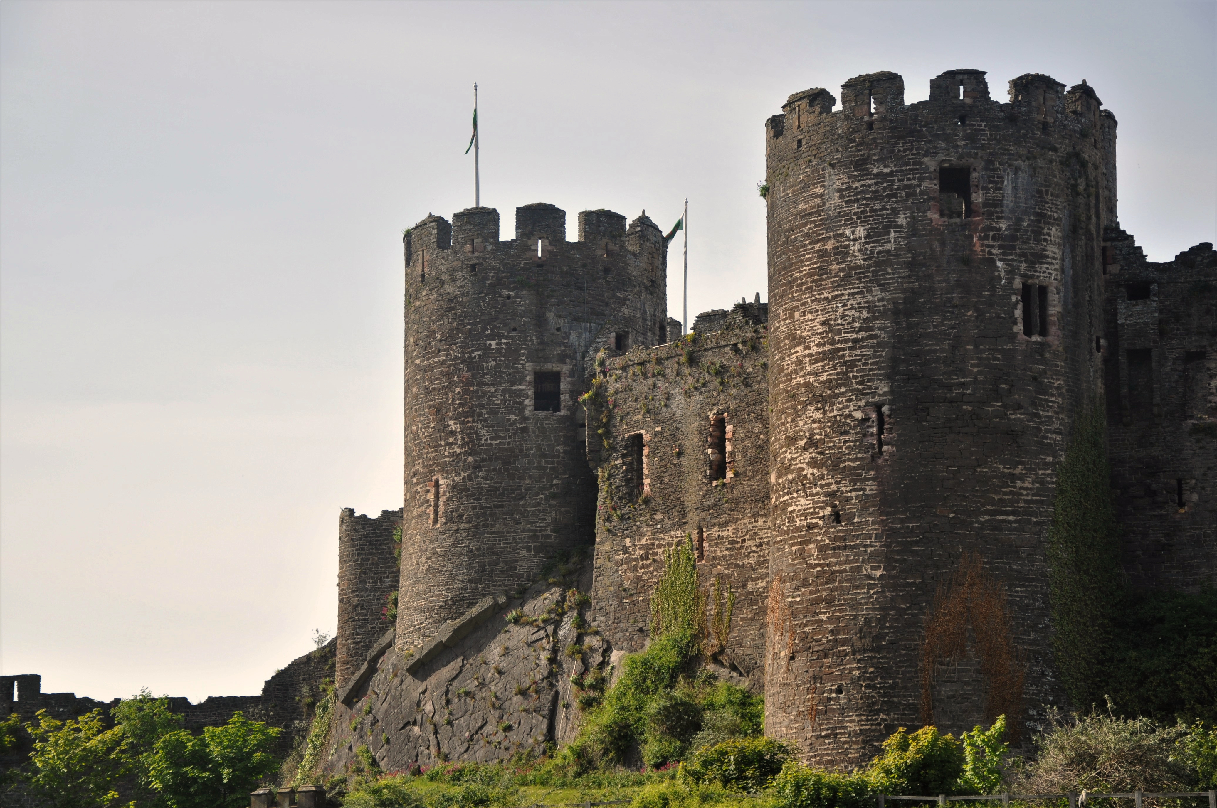 A glimpse of the south-west part of Conwy Castle from the river Gyffin, Conwy County Borough, North Wales
