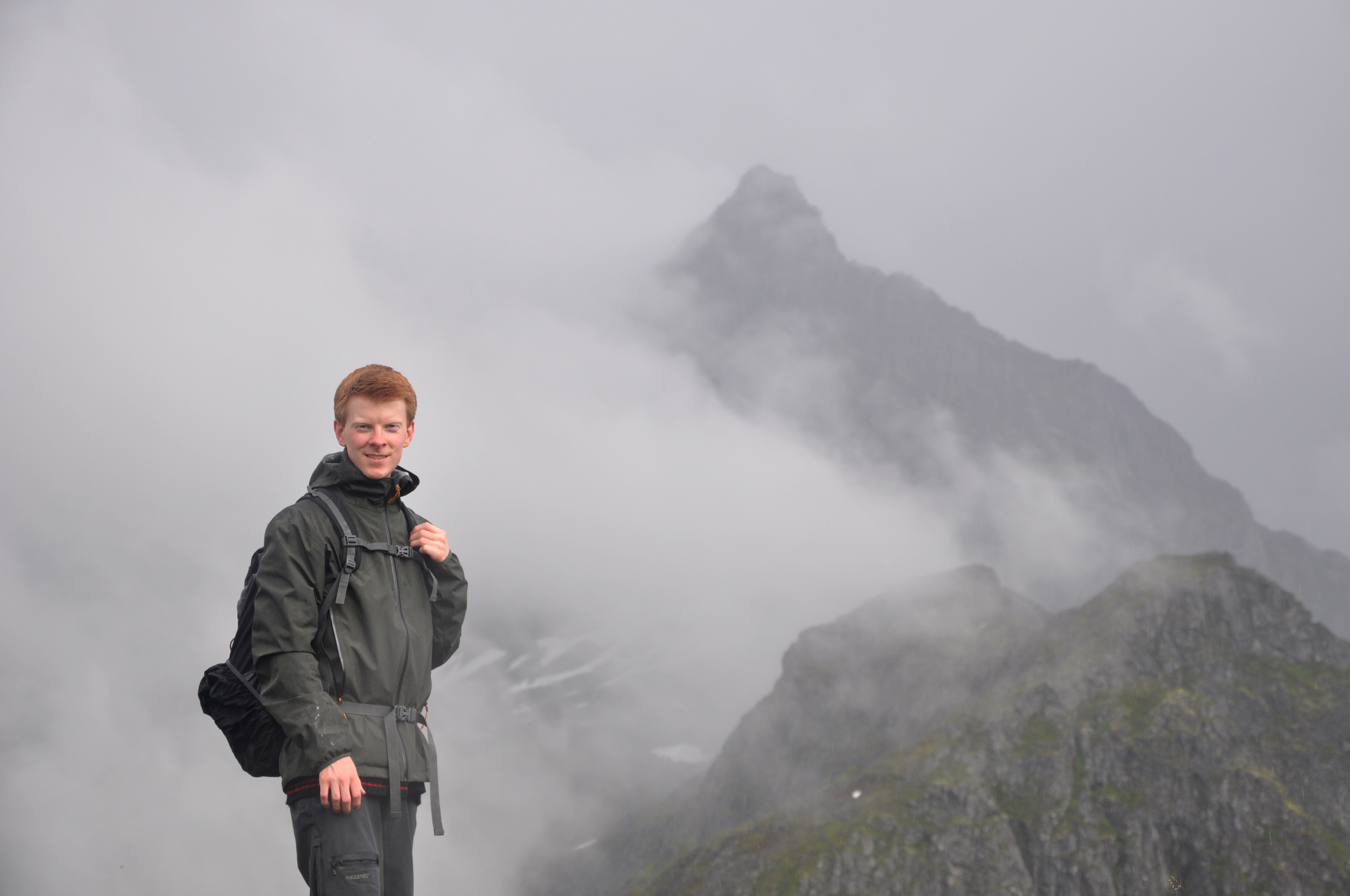 Photo of Børre Andreas Opedal Lunde hiking at Urkeegga with Slogen in the background, Sunnmøre Alps, Norway